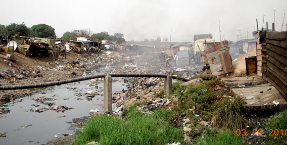 The trash nightmare of the Agbogbloshie Channel, which joins the Odaw Channel farther up. Photo by: Kwei Quartey.