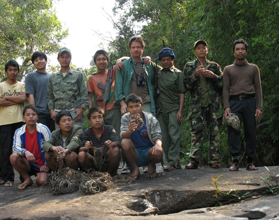 Survey team poses with snares (Robichaud is in the middle) in the Nakai-Nam Theun National Protected Area in the Annamite Mountains. Photo courtesy of William Robichaud.