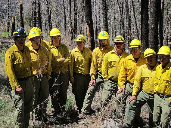 New Mexico firefighters gather to highlight the connection between megafires in their state and climate change. The photo was taken as apart of 'Connect the Dots' day organized by 350.org. It must be noted that this photo was taken a few weeks before the megafire in the Gila National Forest, which is now New Mexico's worst. Photo courtesy of: 350.org.