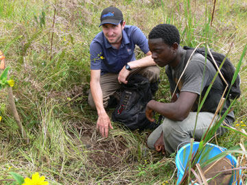 Andrew and Adris researching dung beetles. Photo courtesy of: Hazel Chapman.   