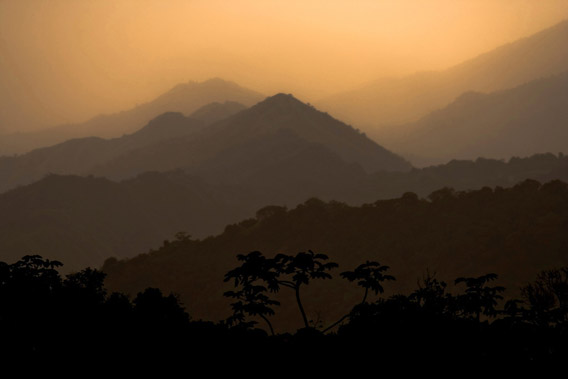 Sunset over the Sierra Nevada de Santa Marta in Colombia. This site is the last remaining refuge of 13 highly threatened species, but also provides many benefits to people. For example, the river basins are a very important source of clean freshwater to downstream human populations, and the tropical rainforest store a significant amount of carbon important for climate change mitigation. The site also has considerable cultural value as about 30,000 indigenous people of four ethnic groups are living in the area and consider it sacred. Photo © Robin Moore/iLCP.