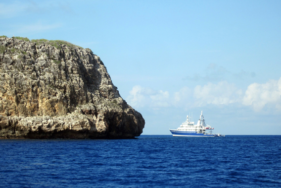 A ship approaches the Caribbean Island of Navassa. Photo by: Eddie Gonzalez.