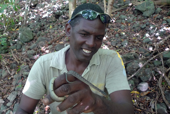 Stephen Lesmond holding one of the world's last Saint Lucia racers. Photo by: T. Ross with DWCT.