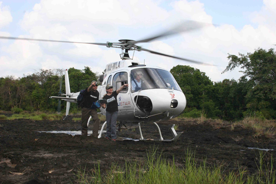  Suwanna with Southern Cardamom Protection Program Chief Advisor Eduard Lefter checking map after aerial patrol. Photo courtesy of Suwanna Gauntlett.