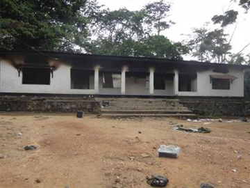 the burned headquarters at the Okapi Wildlife Reserve