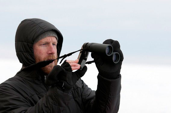 Hugh Powell iPhoniscoping snow petrels in Antarctica. Photo by: Chris Linder.