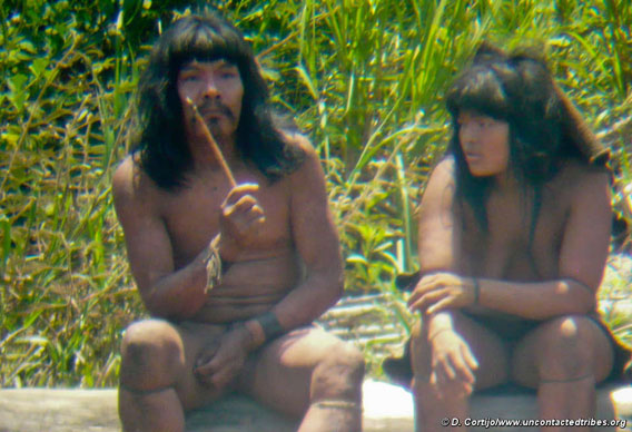 This Mashco-Piro man is holding a wooden-handled knife tipped with a capybara tooth.