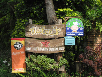  Guest house sign attracting tourists in Thailand. Photo by: Katharine Sims. 